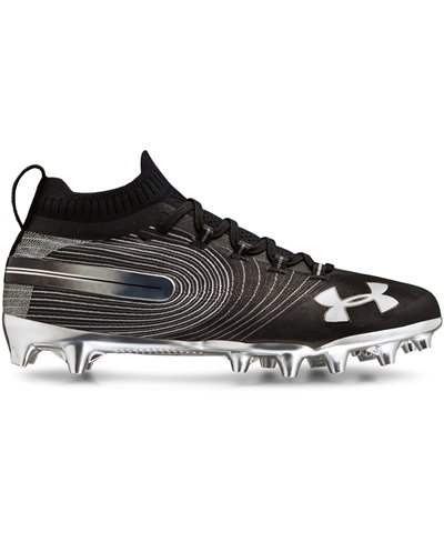gold and black under armour cleats